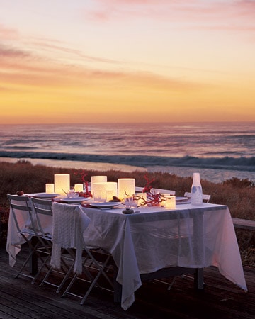If your party is beach side use candles and natural elements like shells or