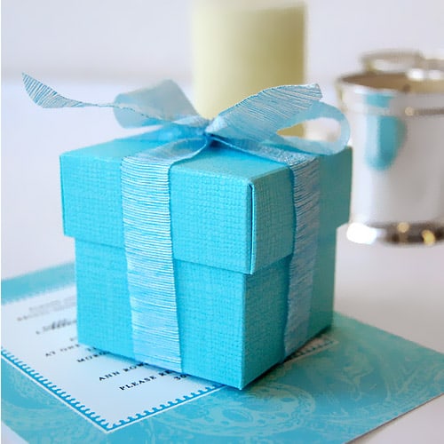 Reception tables draped with Tiffany Blue overlays and topped with chocolate 